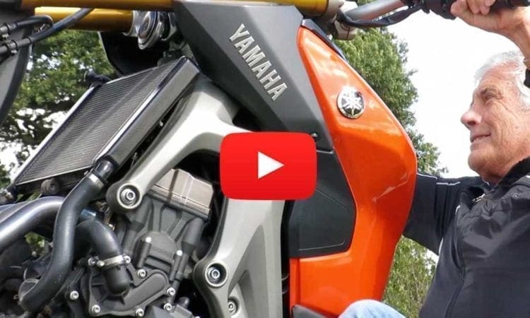 Giacomo Agostini wheelies a Yamaha MT-09